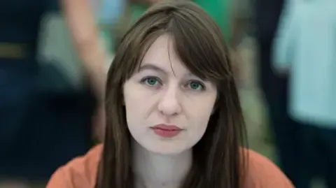 The acclaimed novelist states she will not enter the UK because of arrest fears